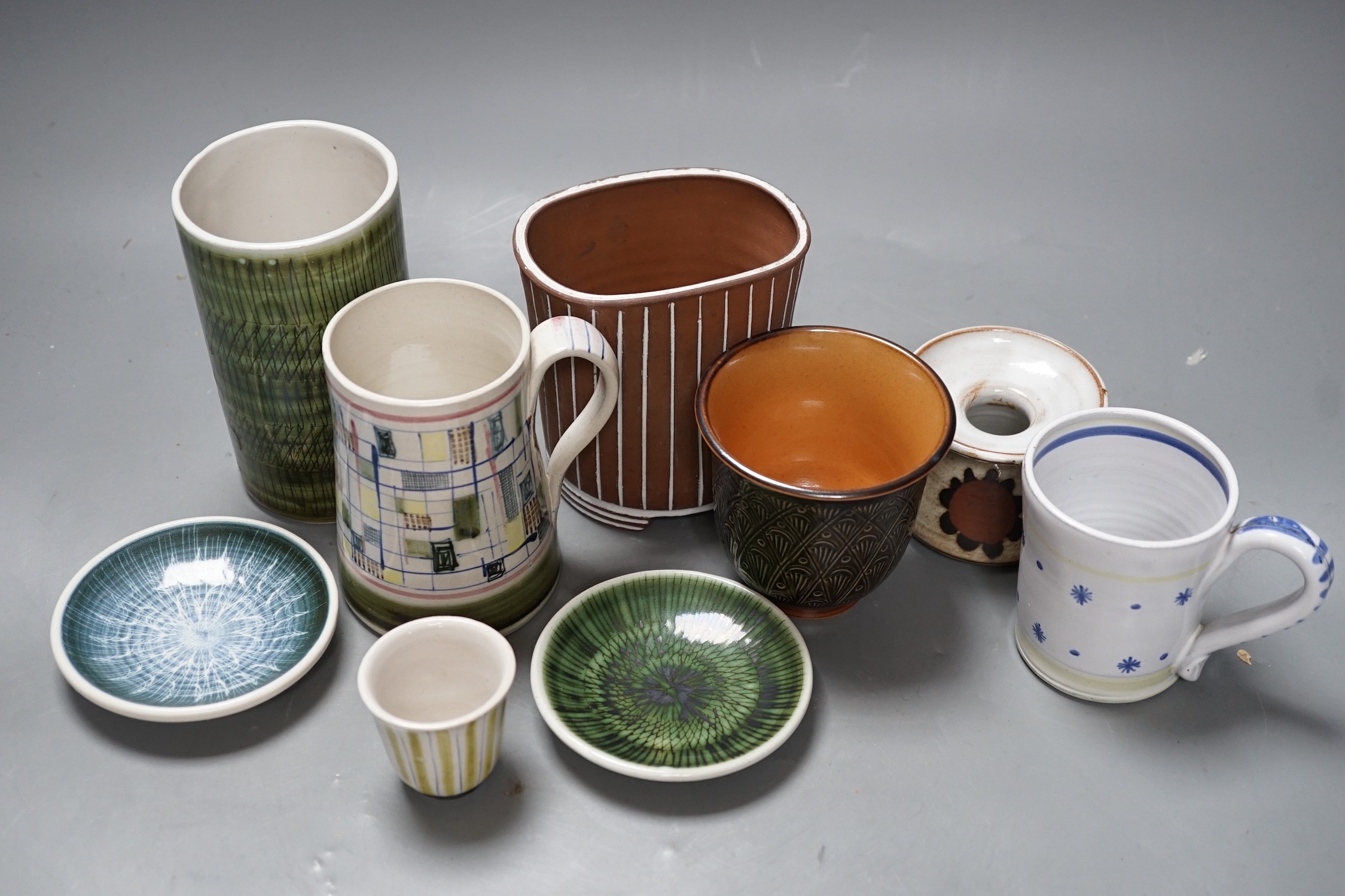 Seven pieces of Rye pottery to include a Dennis Townsend marked mosaic tankard, another small star and dot mug, two sgraffito pin dishes, a Jim Elliot marked terracotta pot, a cylindrical brush pot and a yellow striped t